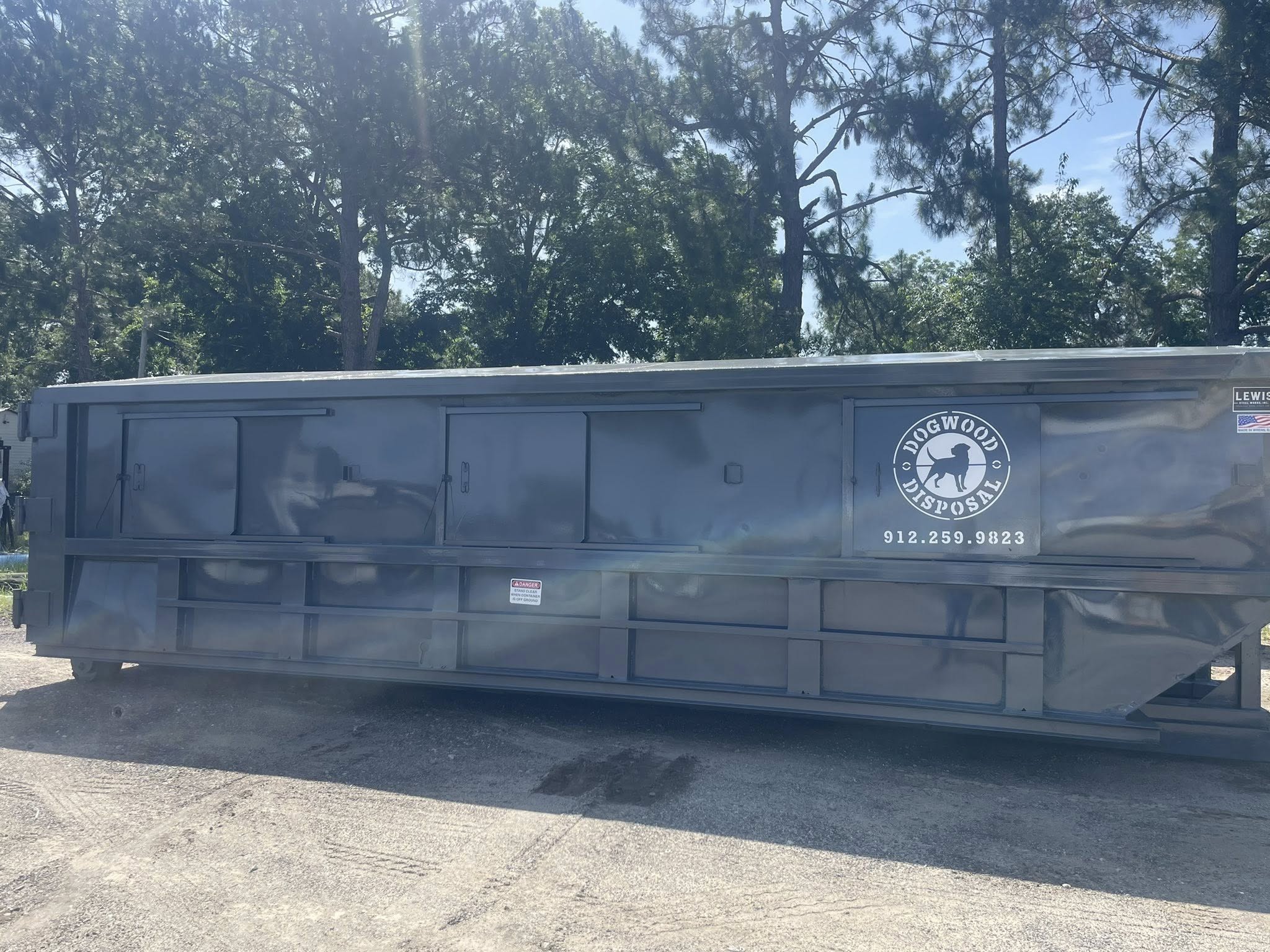 Dogwood Disposal roll-off dumpster on Bulloch County residential property